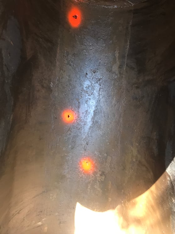 Holes in the bottom of an oil tank