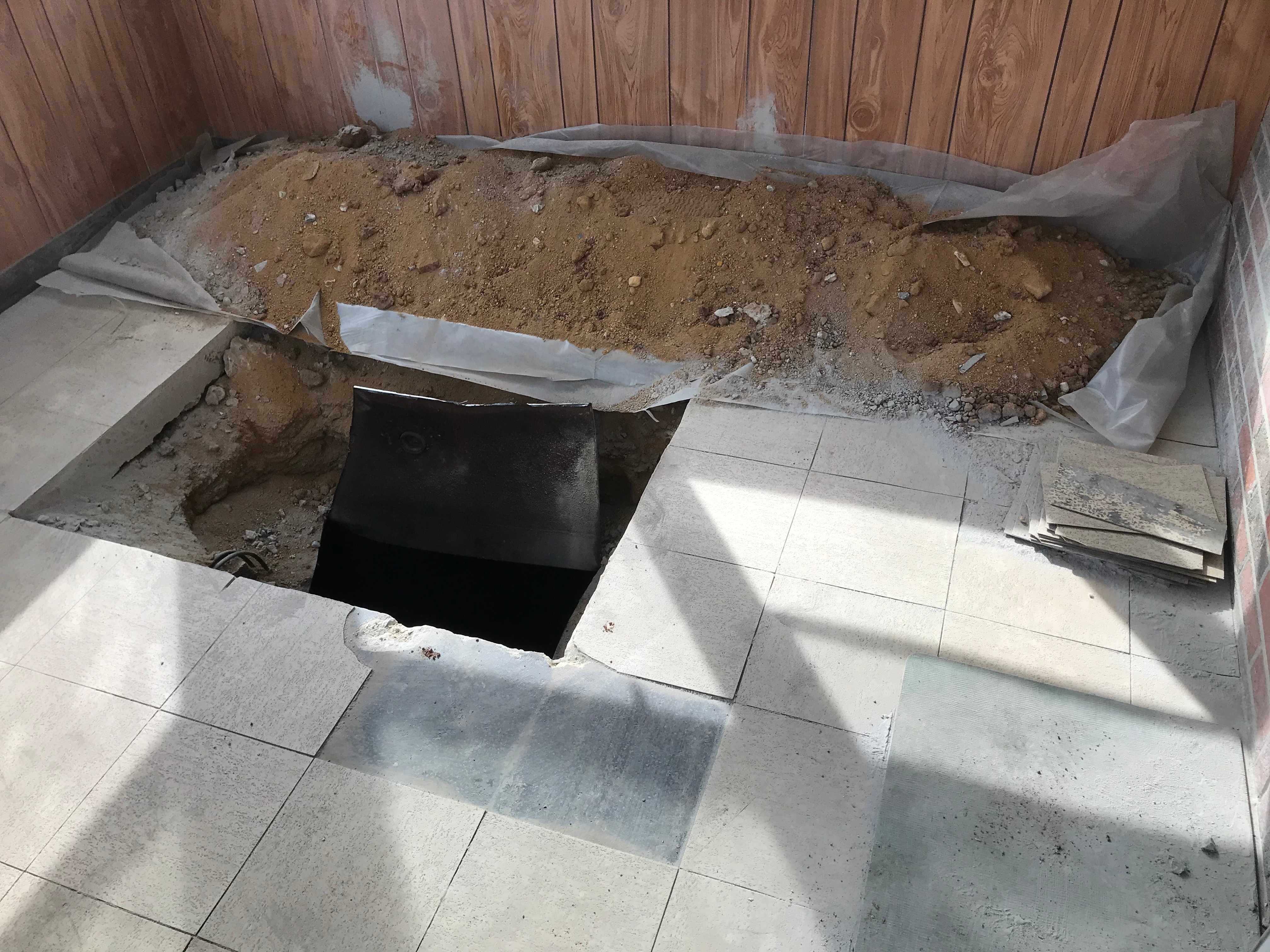 OIl tank under a porch