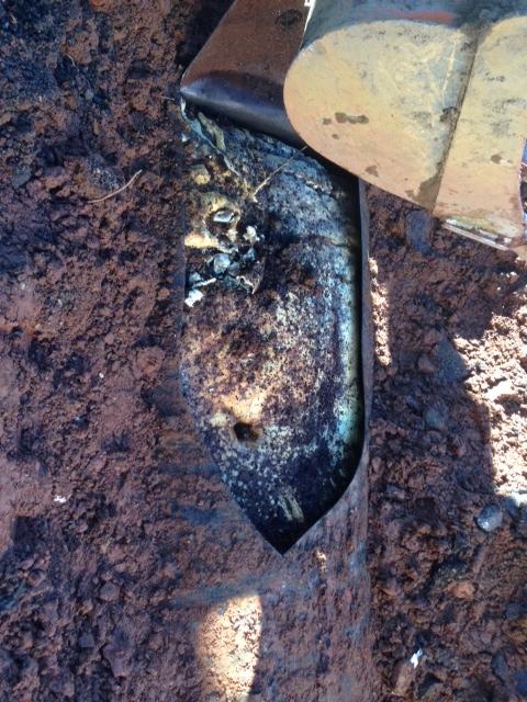 Abandoned oil tank with sand